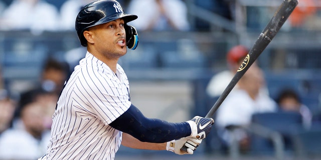 Giancarlo Stanton #27 of the New York Yankees hits a solo home run during the third inning against the San Francisco Giants at Yankee Stadium on April 01, 2023 in the Bronx borough of New York City.