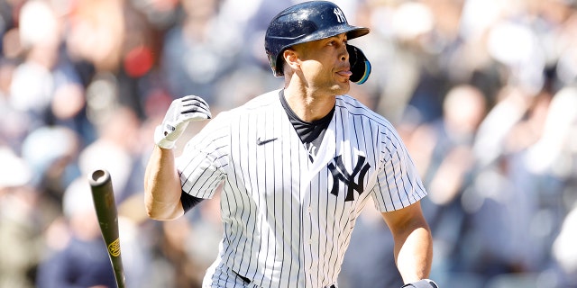 Giancarlo Stanton #27 of the New York Yankees flips his bat after hitting a two-run home run during the third inning against the San Francisco Giants at Yankee Stadium on April 02, 2023 in the Bronx borough of New York City.