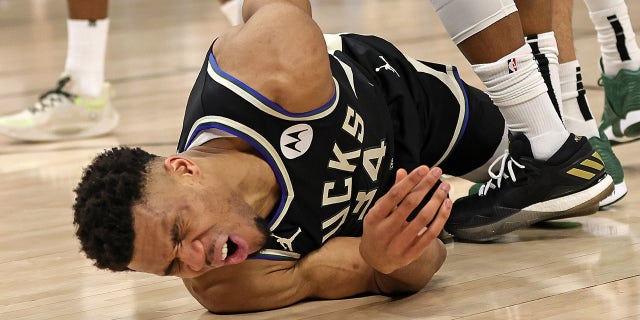 Giannis Antetokounmpo #34 of the Milwaukee Bucks is injured during Game One of the Eastern Conference First Round Playoffs against the Miami Heat at Fiserv Forum on April 16, 2023 in Milwaukee, Wisconsin.