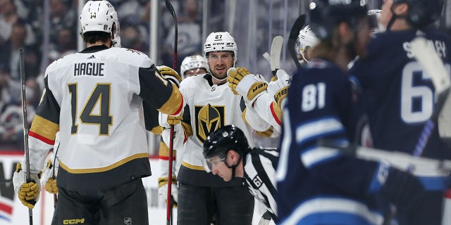 Shea Theodore celebrates the goal