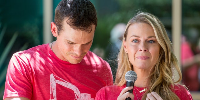 Granger Smith and his wife Amber Smith in tears while wearing red shirts
