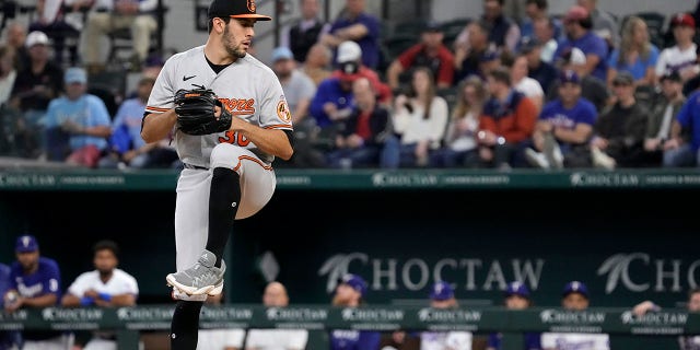 Grayson Rodriguez #30 of the Baltimore Orioles prepares to throw during the first inning of his Major League Baseball debut against the Texas Rangers at Globe Life Field on April 5, 2023 in Arlington, Texas. 