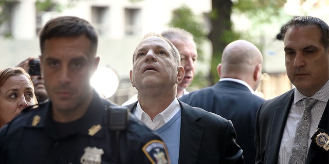 Harvey Weinstein arrives for arraignment at the Manhattan Criminal Courthouse in handcuffs after being arrested and processed on charges of rape, committing a criminal sex act, sexual abuse and sexual misconduct on May 25, 2018, in New York City.