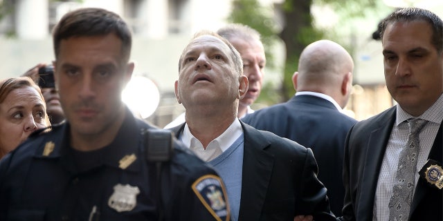 Harvey Weinstein arrives for arraignment at the Manhattan Criminal Courthouse in handcuffs after being arrested and processed on charges of rape, committing a criminal sex act, sexual abuse and sexual misconduct on May 25, 2018, in New York City.