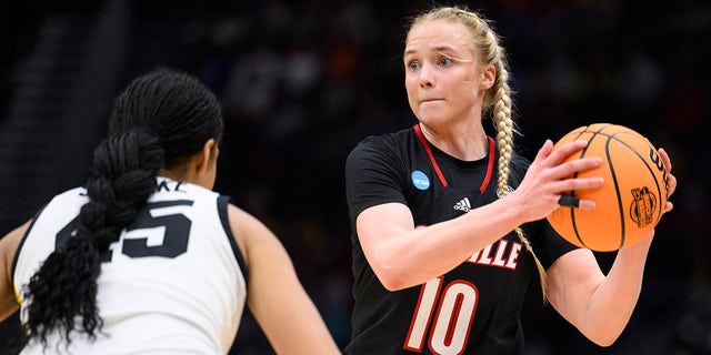 Louisville guard Hailey Van Lith looks to pass as Iowa forward Hannah Stuelke defends in the Elite 8 game of the NCAA Tournament, March 26, 2023, in Seattle.
