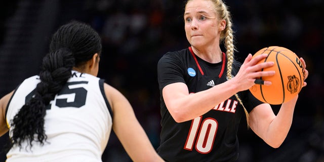 Louisville guard Hailey Van Lith looks to pass as Iowa forward Hannah Stuelke defends in the Elite 8 game of the NCAA Tournament, March 26, 2023, in Seattle.