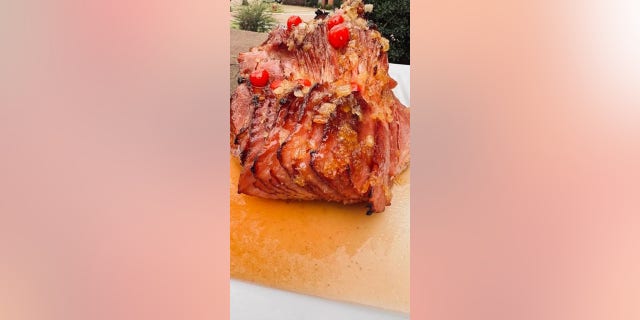 Finish the ham with the iconic maraschino cherry, found on a traditional pineapple upside down dessert.