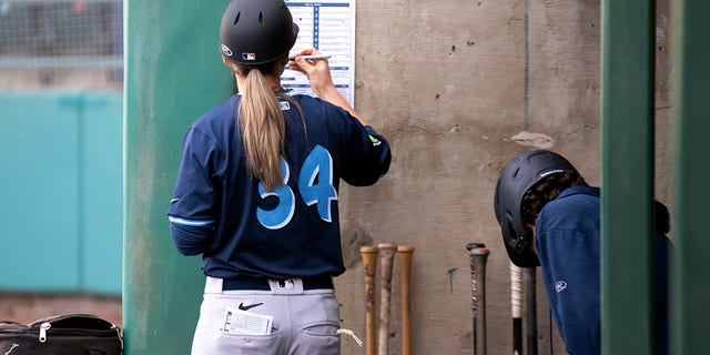 Ronnie Gajownik of the Hillsboro Hops writes on the lineup card in the dugout during a game against the Tri-City Dust Devils at Gesa Stadium Thursday, April 6, 2023, in Paseco, Wash.