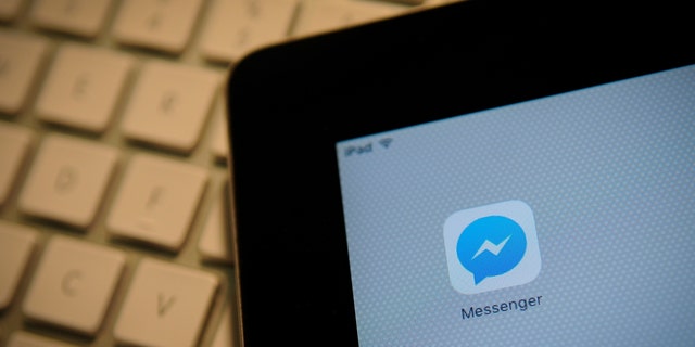 The Facebook Messenger application is seen on an iPad on December 1, 2017. 