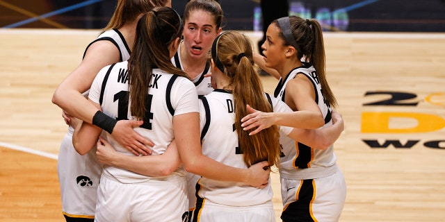 Caitlin Clark #22 of the Iowa Hawkeyes catches her teammates during the third quarter against the LSU Lady Tigers during the 2023 NCAA Women's Basketball Championship game at the American Airlines Center on April 02, 2023 in Dallas, Texas.