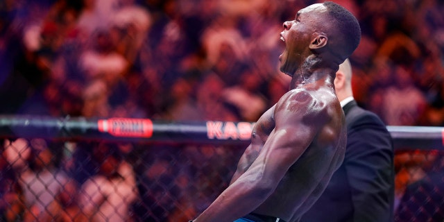 Israel Adesanya celebrates after knocking out Alex Pereira at Kaseya Center on April 8, 2023, in Miami.