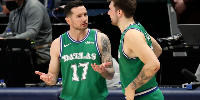 JJ Redick talks to Luka Doncic