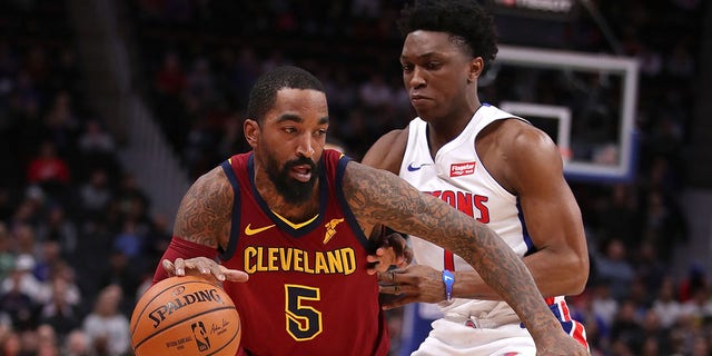 JR Smith #5 of the Cleveland Cavaliers tries to drive around Stanley Johnson #7 of the Detroit Pistons during the first half at Little Caesars Arena on November 19, 2018, in Detroit, Michigan.