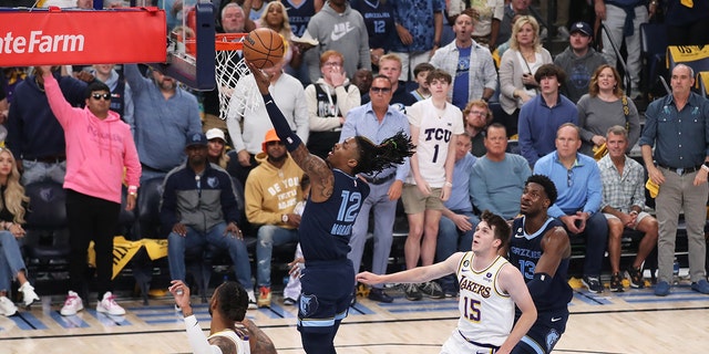 Ja Morant #12 of the Memphis Grizzlies drives to the basket during Round 1 Game 1 of the NBA Playoffs against the Los Angeles Lakers on April 16, 2023 at FedExForum in Memphis, Tennessee.
