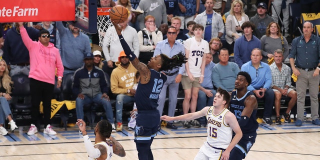 Ja Morant #12 of the Memphis Grizzlies drives to the basket during Round 1 Game 1 of the NBA Playoffs against the Los Angeles Lakers on April 16, 2023 at FedExForum in Memphis, Tennessee.