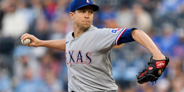 Texas Rangers starting pitcher Jacob deGrom throws to a Kansas City Royals batter during the first inning of a baseball game, Monday, April 17, 2023, in Kansas City, Mo.