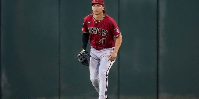 Jake McCarthy #31 of the Arizona Diamondbacks plays center field in the first inning against the Cincinnati Reds during a spring training game at Goodyear Ballpark on March 10, 2023, in Goodyear, Arizona.