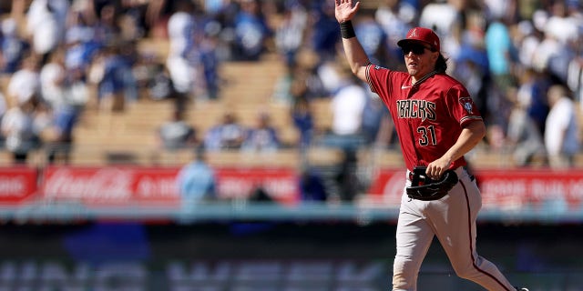 Jake McCarthy #31 of the Arizona Diamondbacks celebrate a 2-1 win over the Los Angeles Dodgers at Dodger Stadium on April 02, 2023, in Los Angeles, California. 