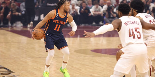 Jalen Brunson (11) of the New York Knicks dribbles the ball during Game 1 of a first-round 2023 NBA playoff series against the Cleveland Cavaliers April 15, 2023, at Rocket Mortgage FieldHouse in Cleveland.