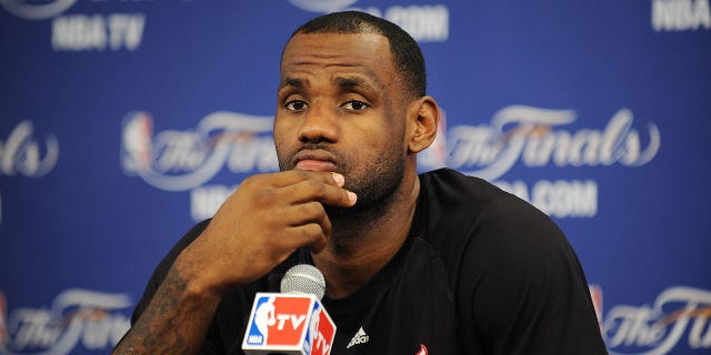 Miami Heat's LeBron James speaks to the media