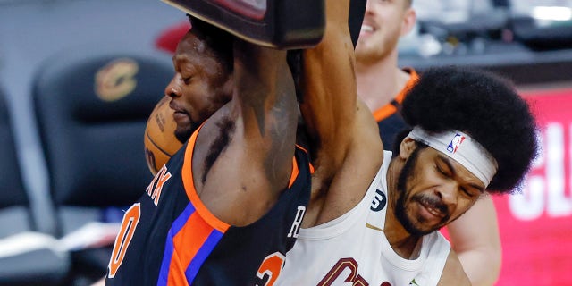 Cleveland Cavaliers center Jarrett Allen, right, fouls New York Knicks forward Julius Randle during the second half of Game 2 of an NBA basketball first-round playoff series, Tuesday, April 18, 2023, in Cleveland.
