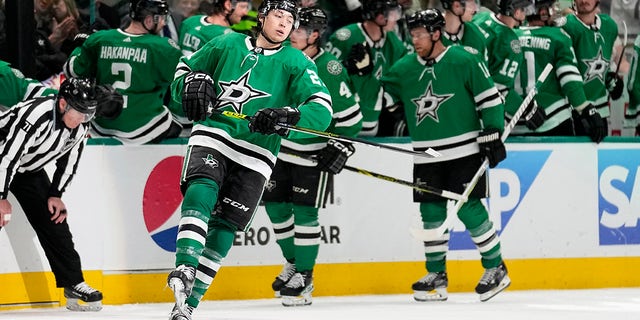 Dallas Stars' Jason Robertson, front, celebrates after scoring against the Minnesota Wild in the second period of Game 1 of an NHL hockey Stanley Cup first-round playoff series, Monday, April 17, 2023, in Dallas. 