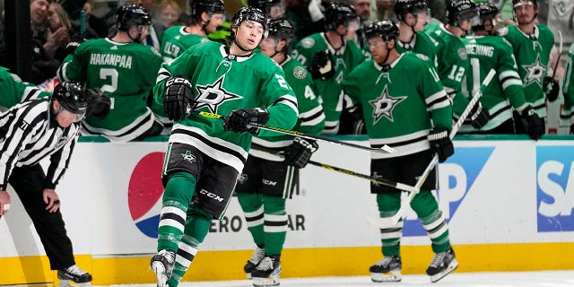 Dallas Stars' Jason Robertson, front, celebrates after scoring against the Minnesota Wild in the second period of Game 1 of an NHL hockey Stanley Cup first-round playoff series, Monday, April 17, 2023, in Dallas. 