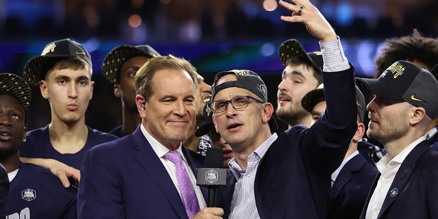 Head coach Dan Hurley of the Connecticut Huskies talks with announcer Jim Nantz after defeating the San Diego State Aztecs at NRG Stadium on April 3, 2023, in Houston, Texas.