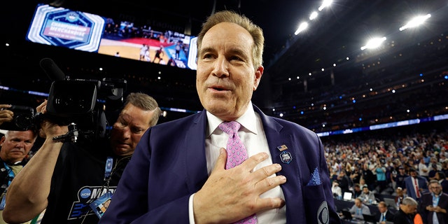 Jim Nantz on the court after Connecticut defeated San Diego State, 76-59, during the NCAA championship game on April 3, 2023 in Houston.