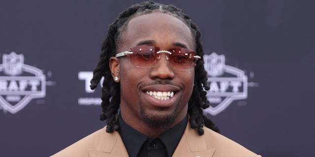 Joey Porter Jr. smiles on the red carpet