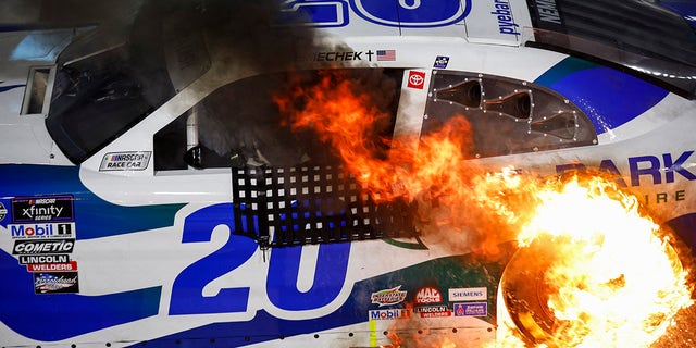 John Hunter Nemechek drives with a tire in flames after winning the NASCAR Xfinity SeriesCall811.com Before You Dig. 250 at Martinsville Speedway on April 15, 2023.