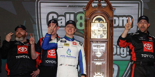 John Hunter Nemechek and crew celebrate after winning the NASCAR Xfinity SeriesCall811.com Before You Dig. 250 at Martinsville Speedway on April 15, 2023, in Virginia.