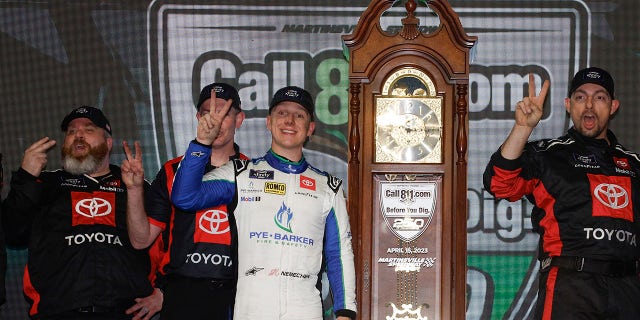 John Hunter Nemechek and crew celebrate after winning the NASCAR Xfinity SeriesCall811.com Before You Dig. 250 at Martinsville Speedway on April 15, 2023, in Virginia.