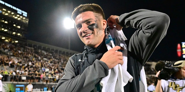 John Rhys Plumlee #10 of the UCF Knights returns to the locker room after defeating the Cincinnati Bearcats 25-21 at FBC Mortgage Stadium on October 29, 2022 in Orlando, Florida.