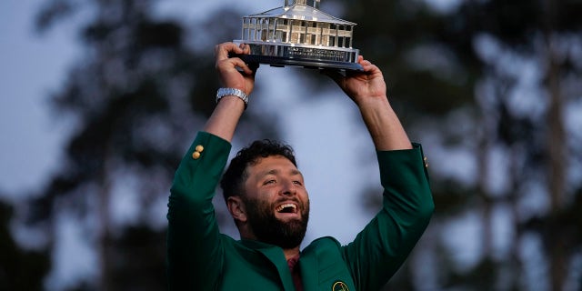 Jon Rahm, of Spain, celebrates holding the Masters trophy winning the Masters golf tournament at Augusta National Golf Club on Sunday, April 9, 2023, in Augusta, Georgia.
