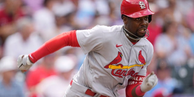 St. Louis Cardinals' Jordan Walker races down the first base line after hitting a single against Colorado Rockies relief pitcher Connor Siebold, Wednesday, April 12, 2023, in Denver.