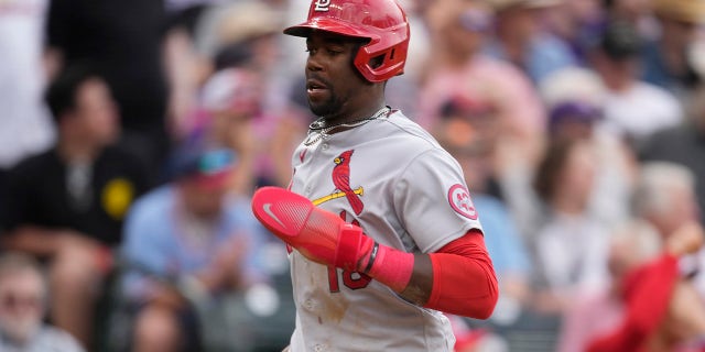 St. Louis Cardinals' Jordan Walker scores on Paul Goldschmidt's single against the Colorado Rockies, Wednesday, April 12, 2023, in Denver.