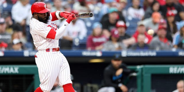 Josh Harrison #2 of the Philadelphia Phillies singles during the second inning against the Miami Marlins at Citizens Bank Park on April 11, 2023 in Philadelphia, Pennsylvania. 