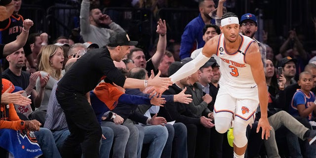 Josh Hart shakes hands with fans