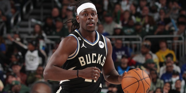 Jrue Holiday #21 of the Milwaukee Bucks dribbles the ball during the game against the Miami Heat during Round One Game One of the 2023 NBA Playoffs on April 16, 2023 at the Fiserv Forum Center in Milwaukee, Wisconsin. 