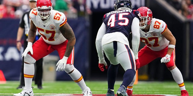 Orlando Brown Jr. (57) of the Kansas City Chiefs and Travis Kelce (87) face the Houston Texans at NRG Stadium on December 18, 2022 in Houston. 
