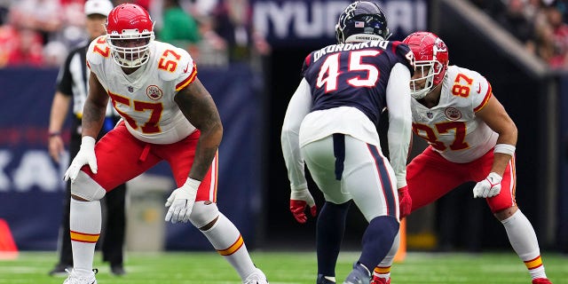 Orlando Brown Jr. (57) of the Kansas City Chiefs and Travis Kelce (87) face the Houston Texans at NRG Stadium on December 18, 2022 in Houston. 