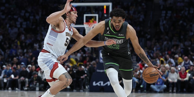 Karl-Anthony Towns shoots to basket