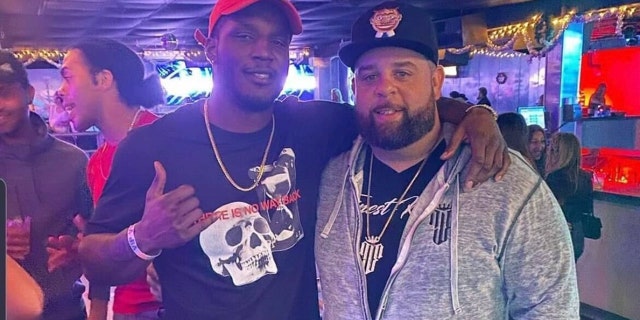 Ex-UFC fighter Karl Roberson, left, takes photo with Ryan Leonard. Roberson was charged with home burglary after allegedly robbing Leonard of $200,000 worth of jewelry.