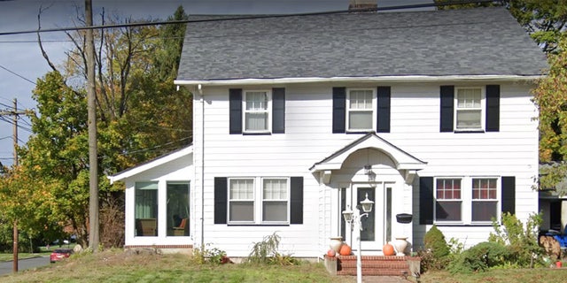 White two-story home in Roselle, New Jersey.