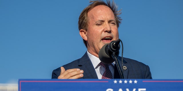 Ken Paxton speaks at podium