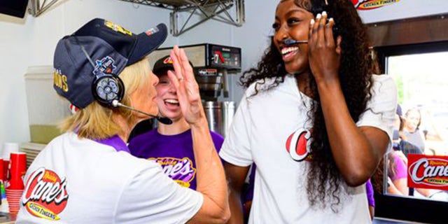 Kim Mulkey, left, and Flau'jae Johnson at Raising Canes.