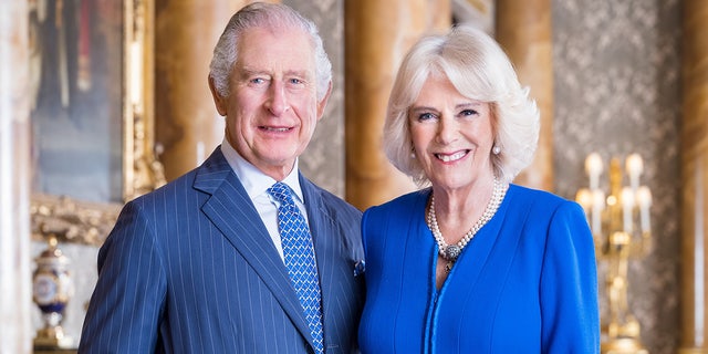 King Charles III and Queen Consort Camilla pose for royal portrait.