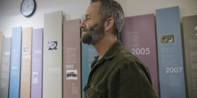 Kirk Cameron looking on and smiling.