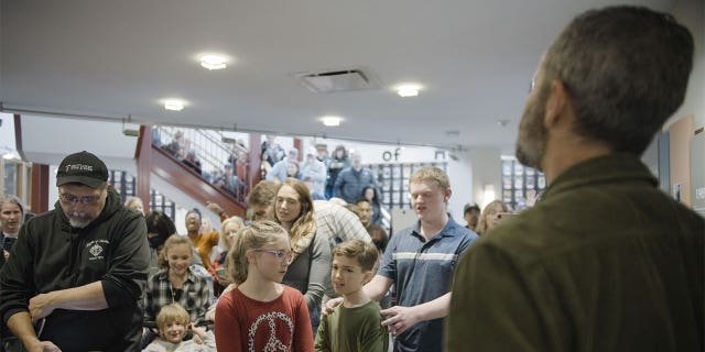 Kirk Cameron facing a crowd.